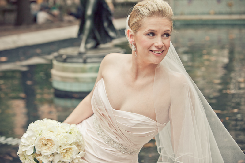 Bride poses in Center City Philadelphia park before her wedding ceremony at the Kimmel Center.