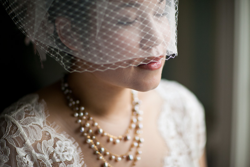 Bride poses with her veil before her modern, winter wedding in Philadelphia, photos by Sweetwater Portraits.