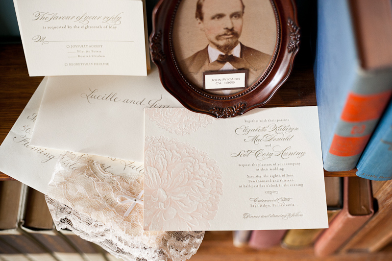 Unique antique details of the delicate invitations during a wedding at Cairnwood Estate.