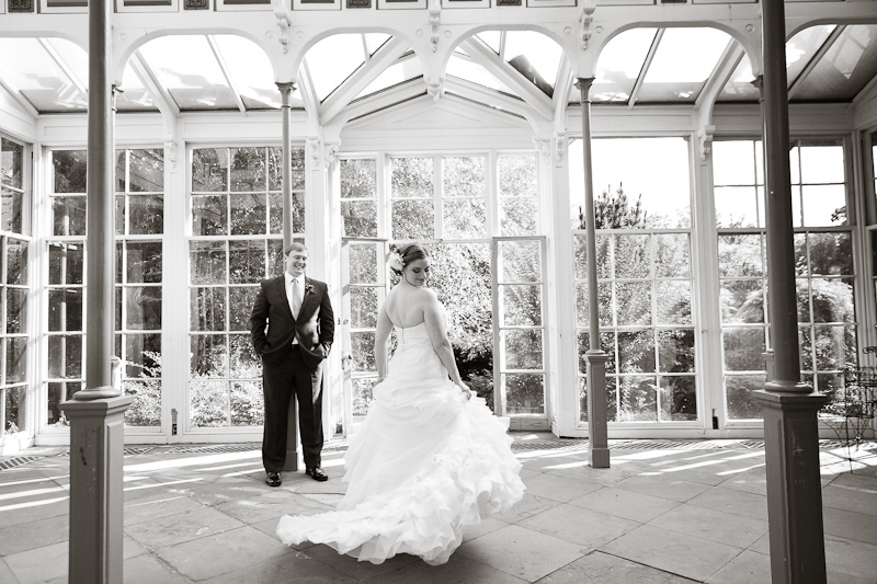 Bride and groom inside the vintage greenhouse at the Rockwood Carriage House in Wilmington.