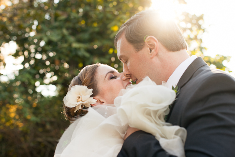 Outdoor fall portraits of the bride and groom before their Delaware wedding at the rustic Rockwood Carriage House.