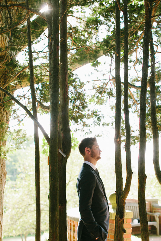 Groom waits for his bride at this outdoor garden venue, Morris Arboretum, photos by Sweetwater Portraits.