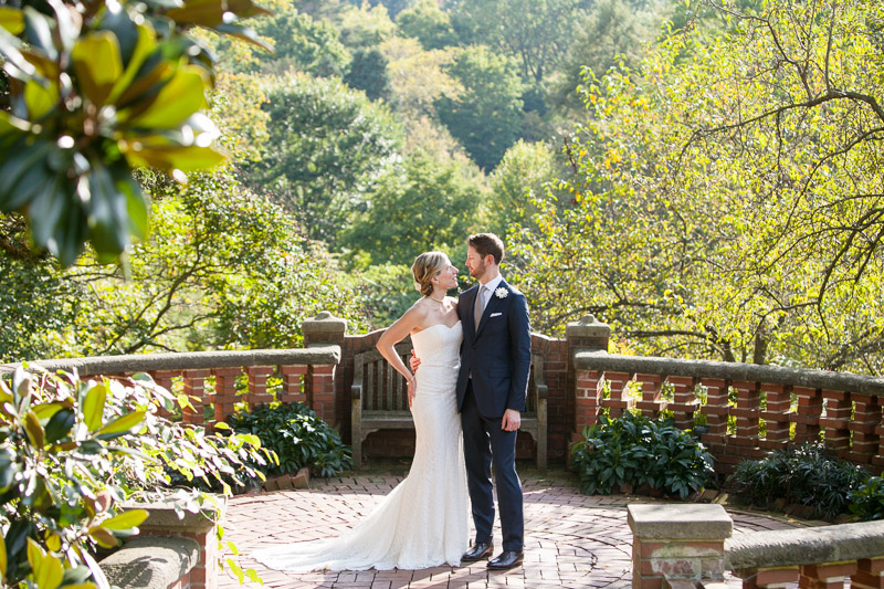 Portraits of the bride and groom at Morris Arboretum before their fall wedding ceremony.