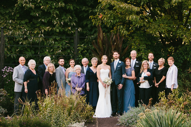 Bride and groom with their family during their wedding at Morris Arboretum in Philadelphia.