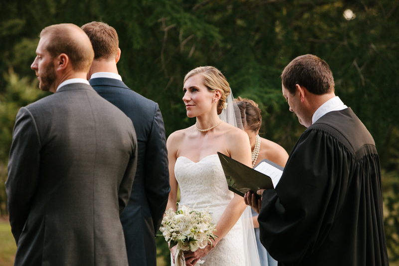 Bride and groom at their outdoor fall wedding ceremony at Morris Arboretum in Philadelphia, PA.