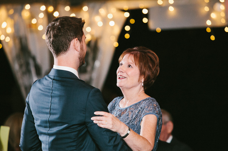 Groom dances with mom at his outdoor wedding reception at Morris Arboretum in Philly.