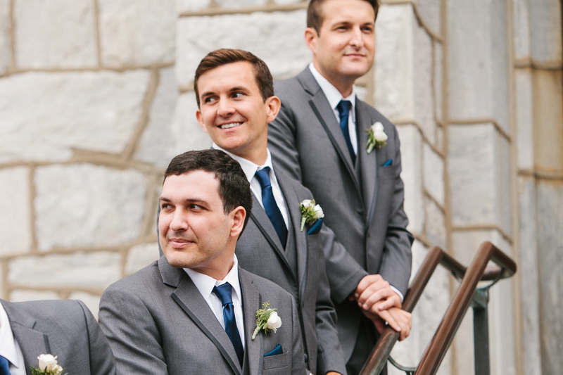 Groomsmen during the wedding ceremony exit from Villanova Chapel on the Main Line.