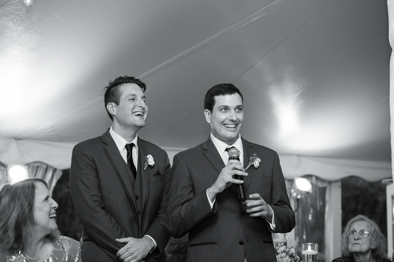 Groomsmen toast to the bride and groom during their wedding reception at Appleford, a unique estate venue in Villanova.