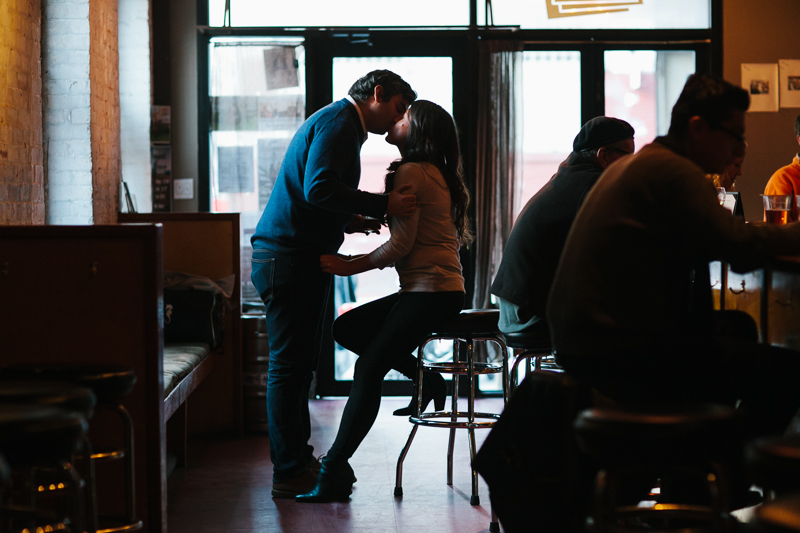 A fun and candid engagement session in New York City at a local Brooklyn bar in Dumbo.