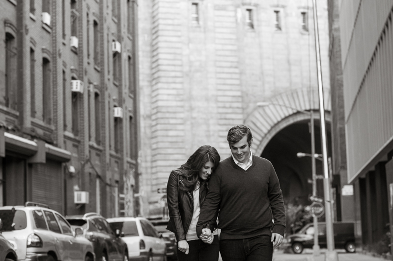 A couple walks through Dumbo during this urban NYC spring engagement session.