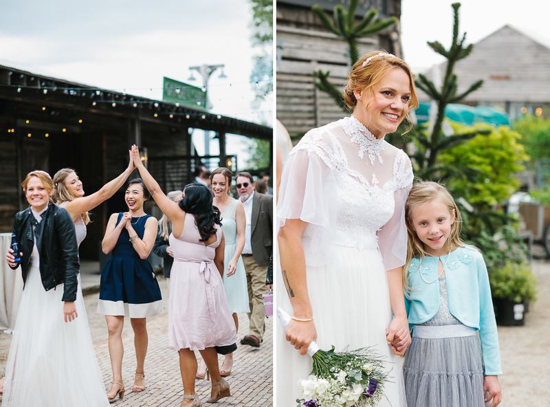 Bride laughs with guests before her rustic, vintage wedding at Terrain near Philadelphia.