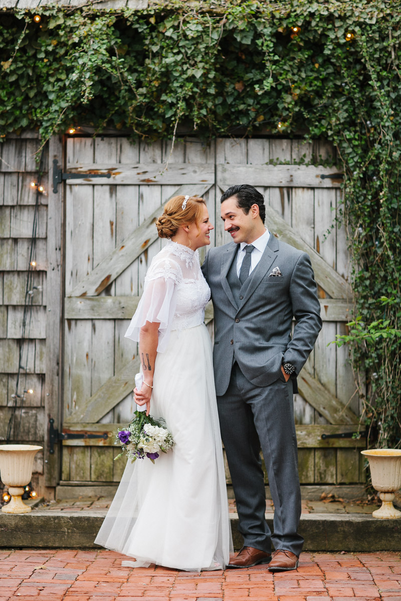 Boho inspired portrait of the bride and groom emphasizing the rustic, vintage decor of Terrain in Glen Mills.