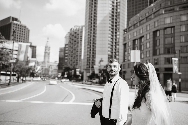 Bride and groom walk around Center City in Philadelphia
