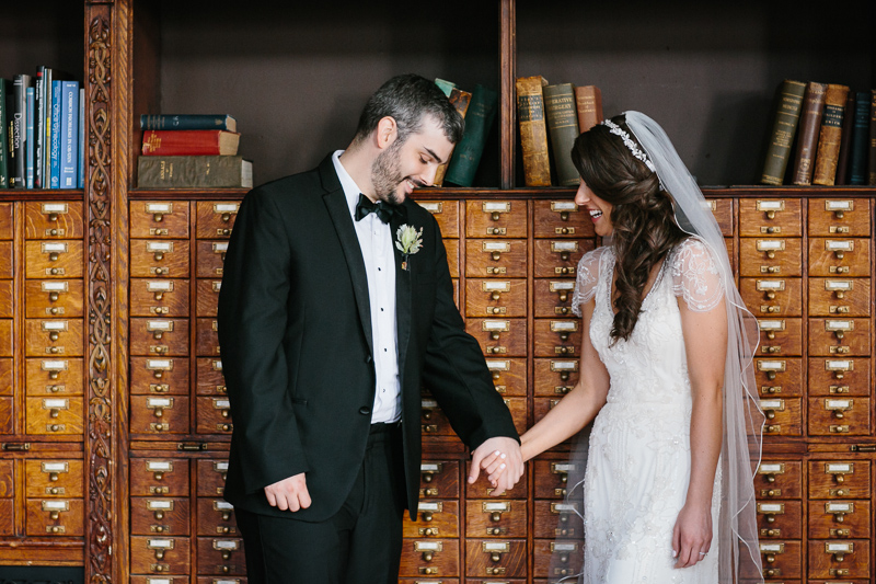 Bride and groom in the library at the College of Physicians
