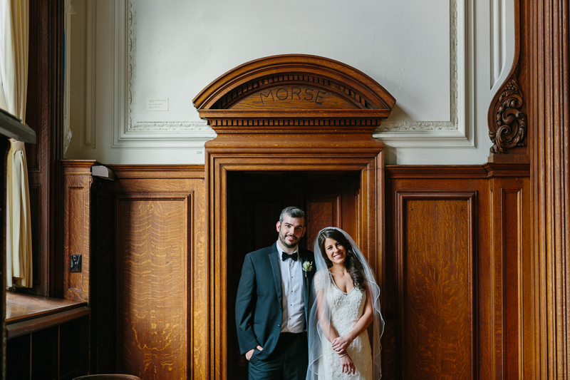 Bride and groom stand in a doorway at the College of Physicians