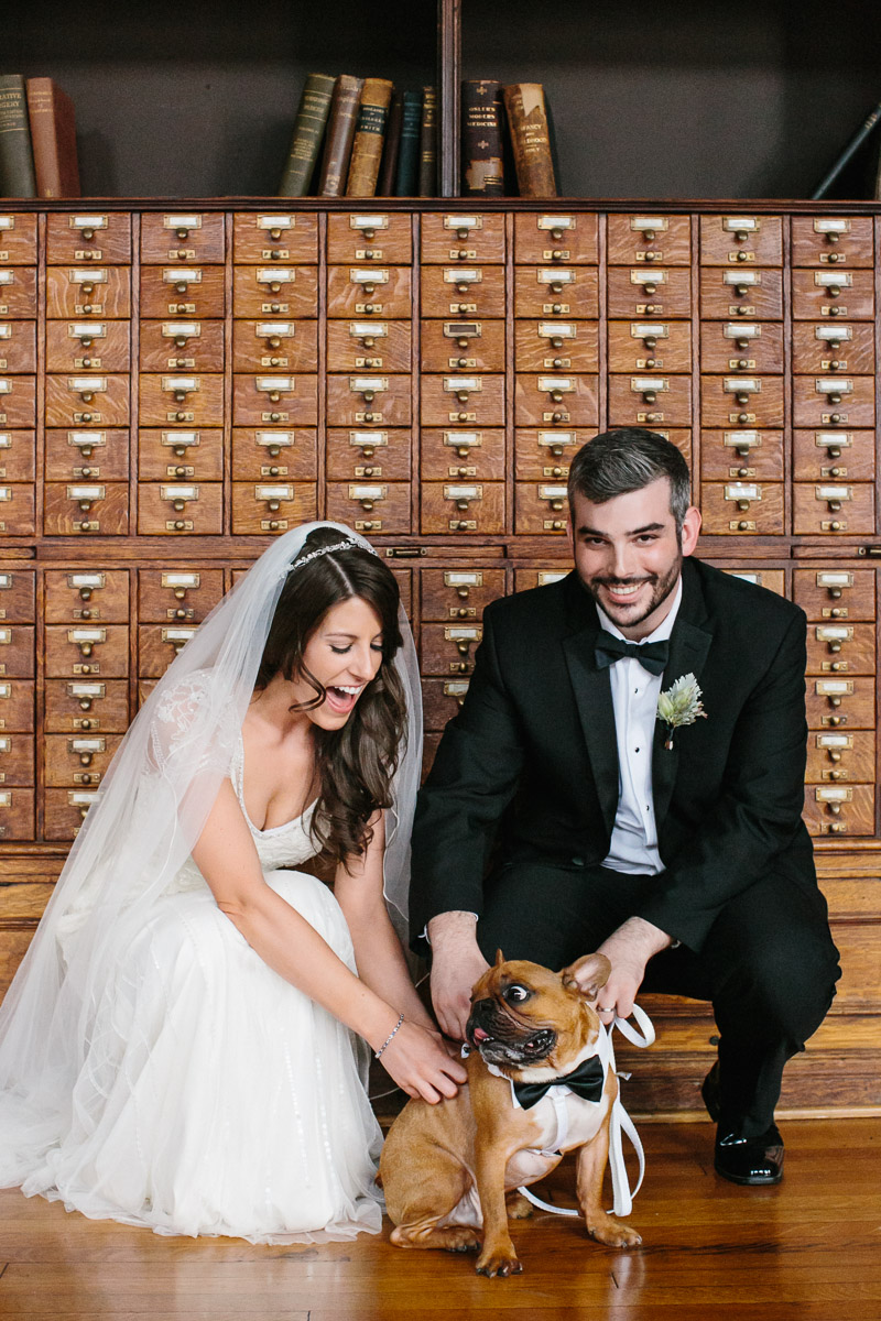 Bride and groom pose with their dog at the College of Physicians