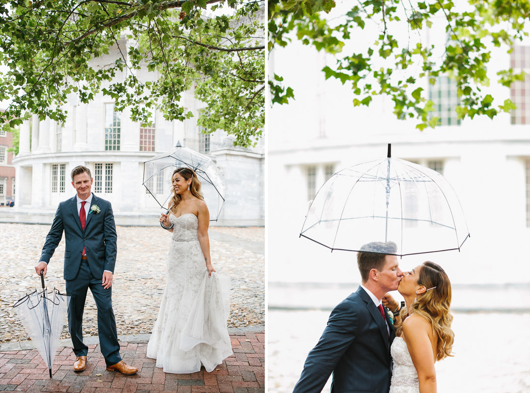 The rain comes during portraits of the bride and groom in Independence Park. 