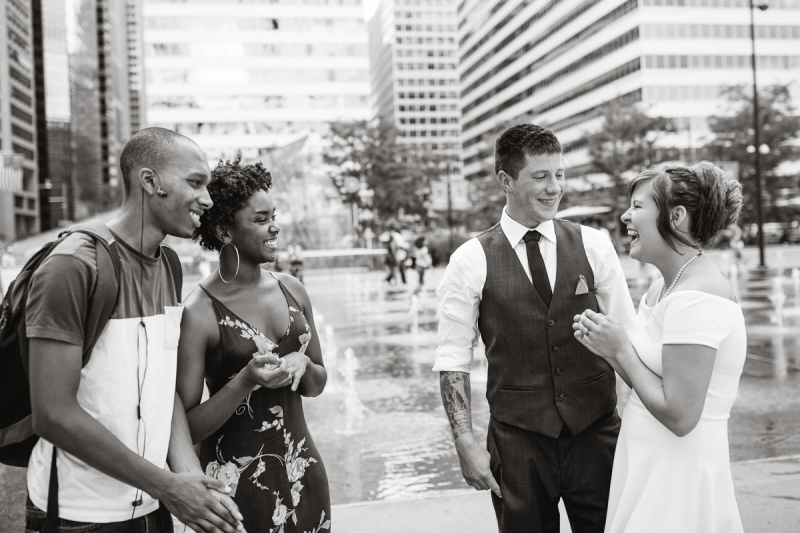 People on the street share a unique moment after signing this couple's marriage certificate.