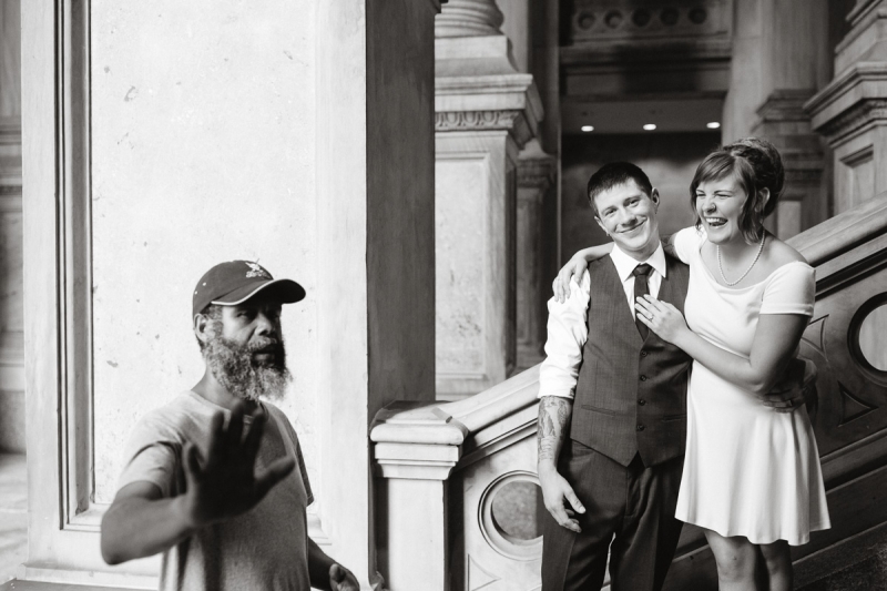 A unique, off-beat moment during wedding portraits at City Hall.