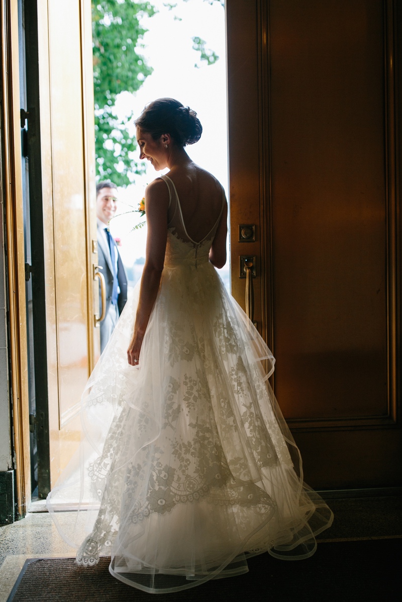 A portrait of the bride before she walks down the aisle at her modern outdoor Philadelphia wedding ceremony.