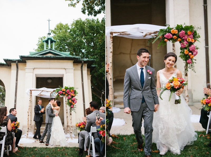 Bride and groom walk down the aisle together after their modern, outdoor wedding.