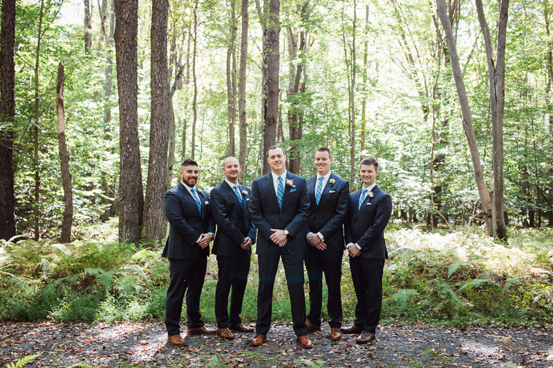 Portraits of the groom with his groomsmen before the ceremony at Lake Naomi Club. 