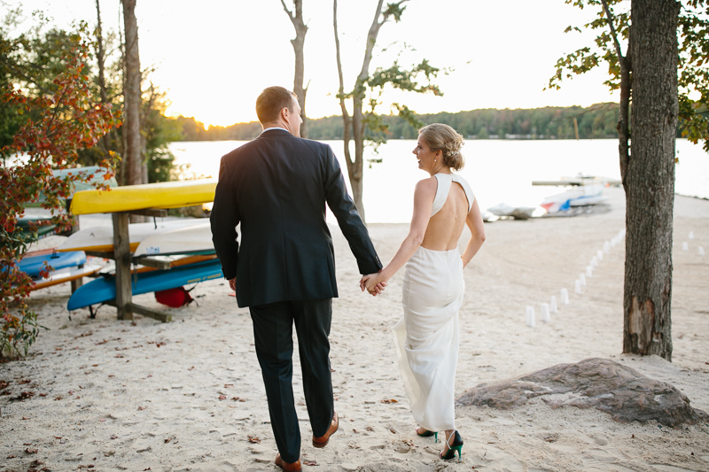 Modern bride and groom portraits alongside a lake sunset in the Poconos.