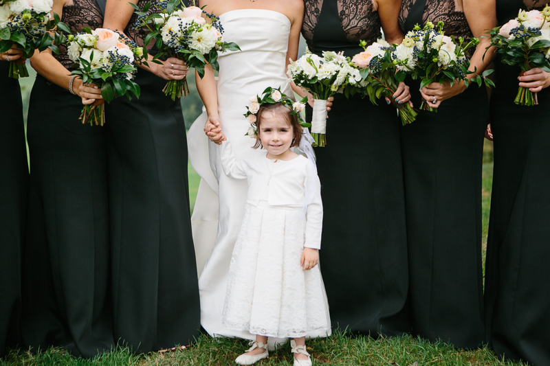 Natural wedding photo of flower girl and bride