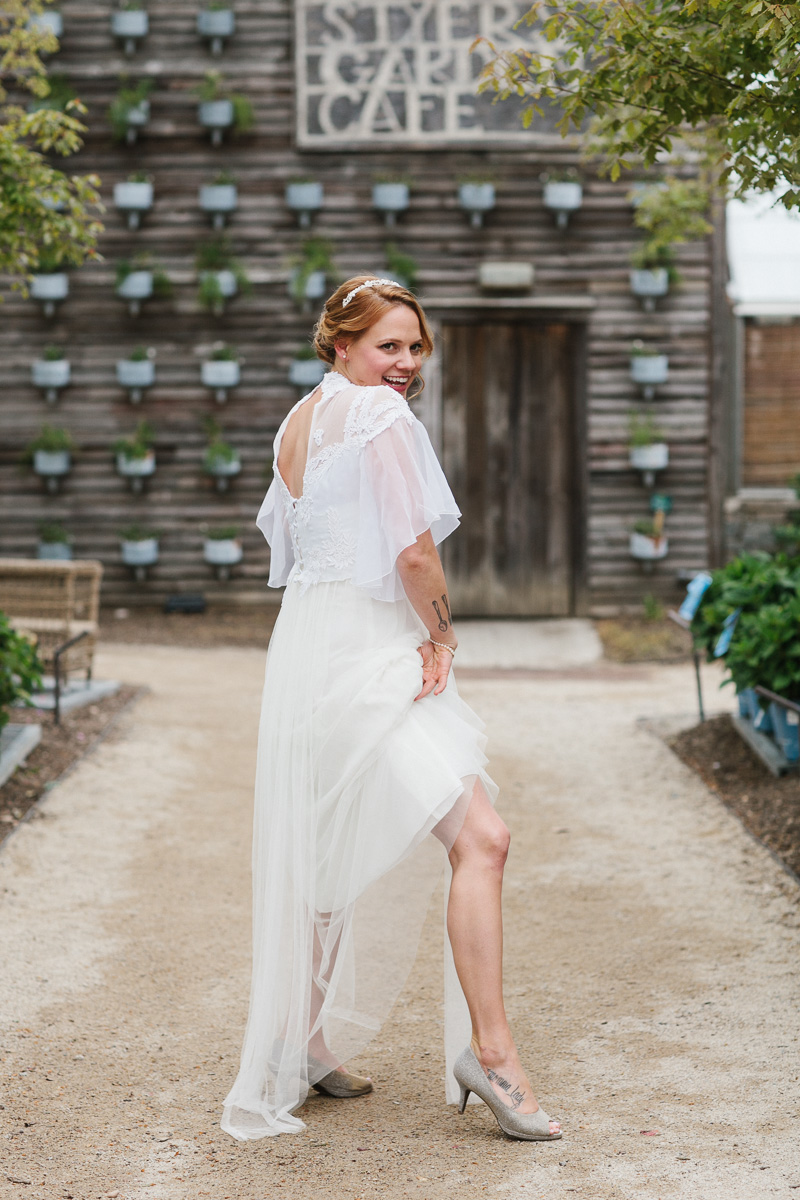 A fun, offbeat bride gets ready for her outdoor garden wedding hosted by Terrain at Styer's.