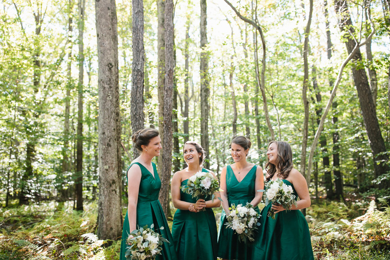 Bridesmaids in the woods at this rustic but modern wedding in the Poconos at Lake Naomi Club.