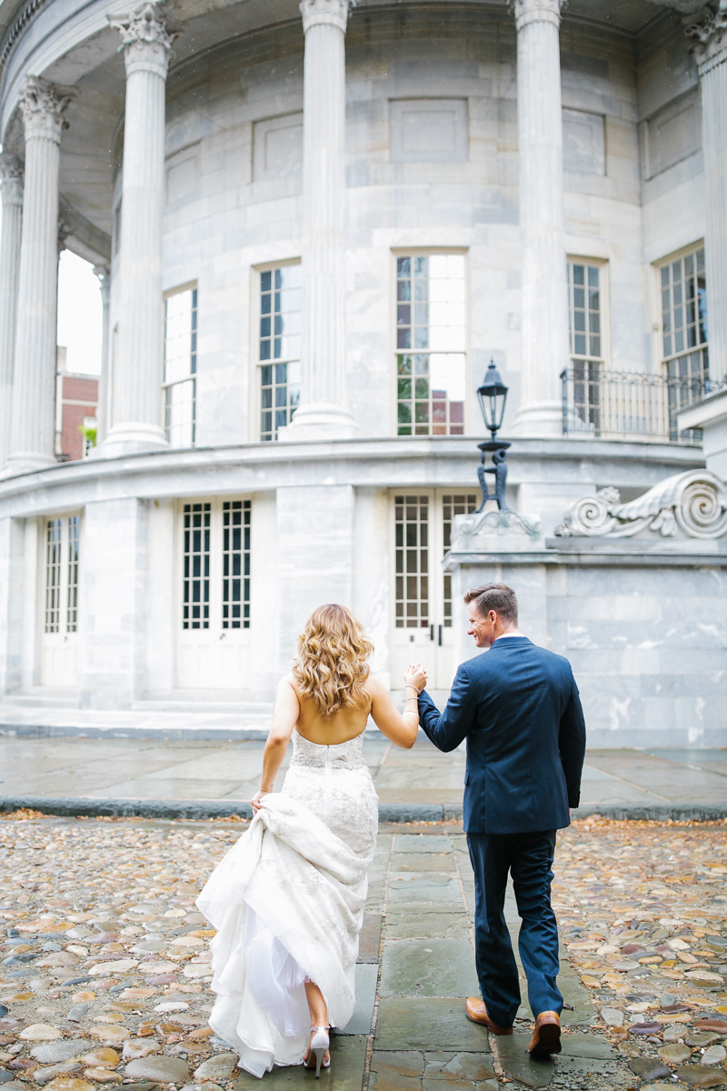 A glam-modern wedding in Philadelphia, portraits in Independence Park after some rain.