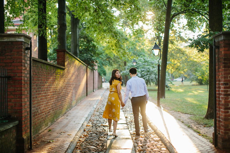 A gorgeous sun sets during this classic engagement session along the historic cobblestone streets of Independence Park in Philadelphia.