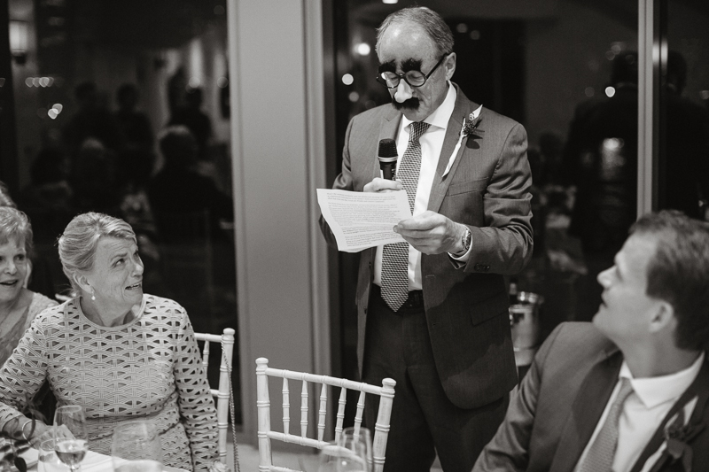 Father of the bride makes a toast during this modern wedding reception.