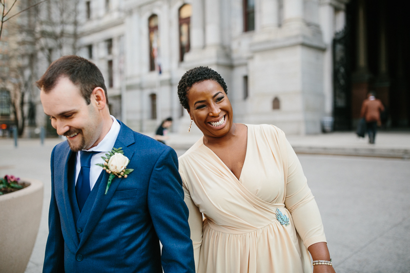 Unique and creative candids of the bride and groom after their elopement wedding at City Hall.