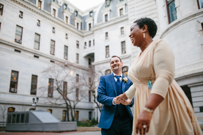 Unique portraits of the bride and groom at their City Hall elopement.