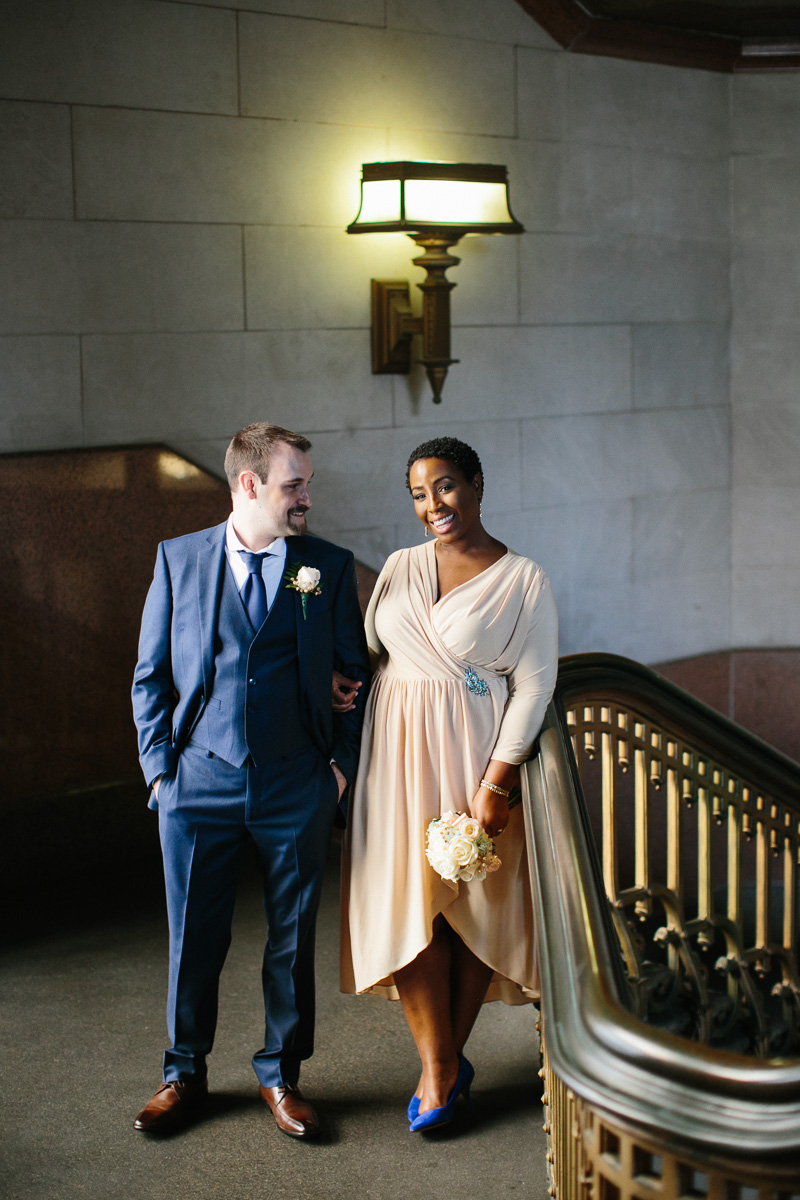 City Hall elopement couple on top of the classic staircase in Philadelphia.