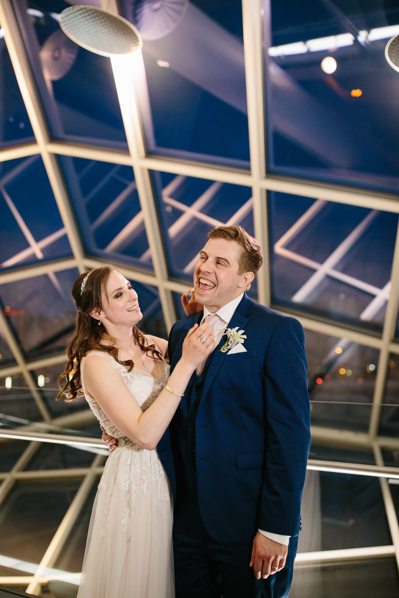 Unique portraits of the bride and groom at night in Philadelphia.