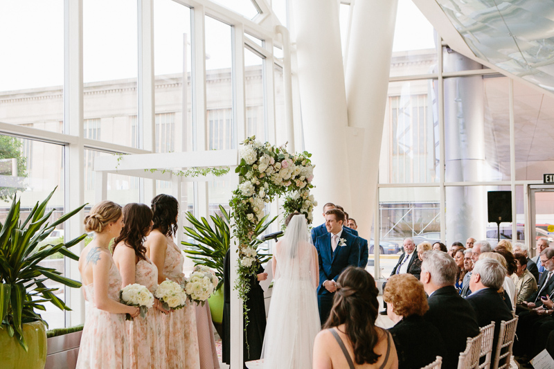 Light + airy atrium wedding ceremony in Philadelphia, PA.