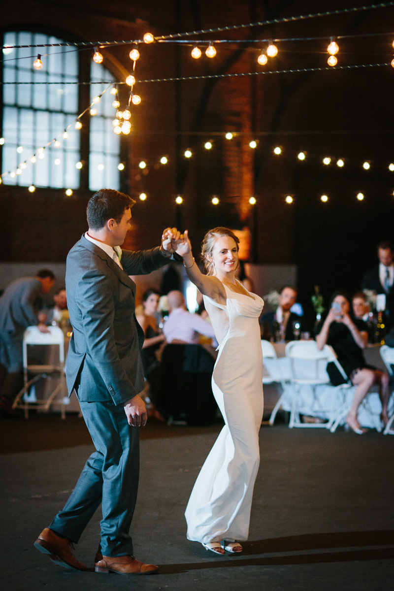 Couple celebrates 23rd Street Armory wedding with their first dance.