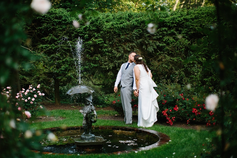 Bride and groom pose in the gardens of Appleford Estate.