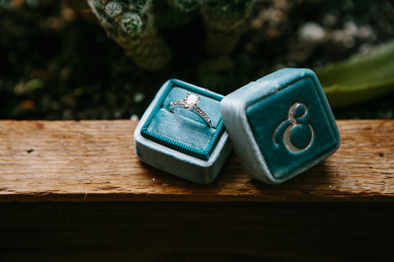 Details of a turquoise blue ring box before the wedding ceremony.