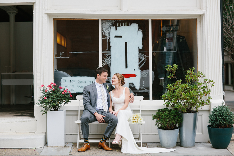 Bride and groom explore the cobblestone streets of Philadelphia.