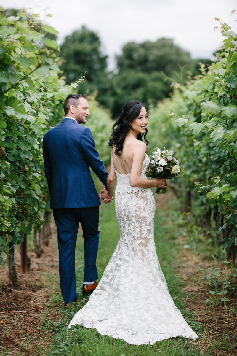Bride and groom in the vineyard at Grace Winery, formerly Sweetwater Farm. 