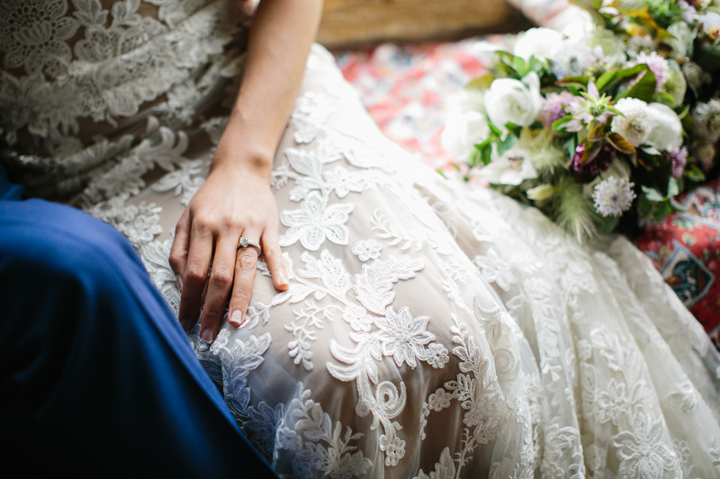 Details of the bride's dress and engagement ring before the ceremony at Grace Winery.