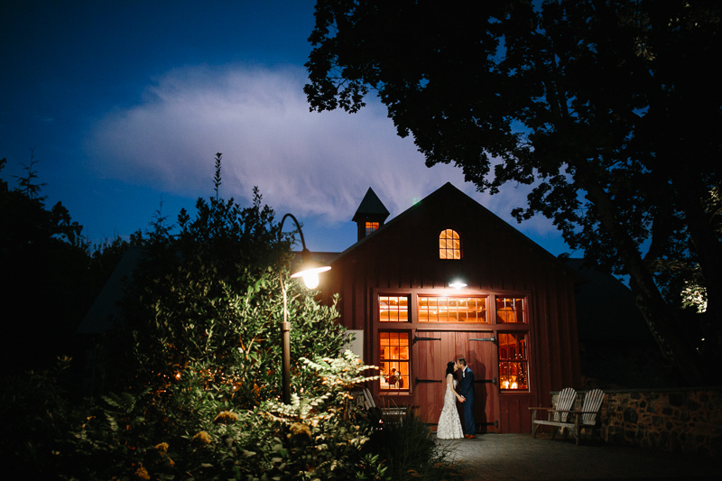 Outdoor night portraits of the bride and groom at Grace Winery, formerly Sweetwater Farm.