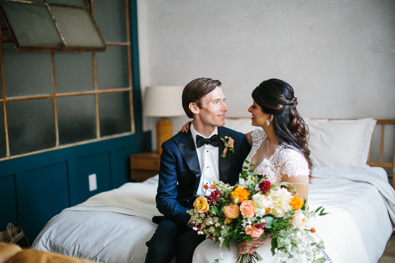 Fall hues decorate this hotel room at Lokal, before their unique museum wedding.