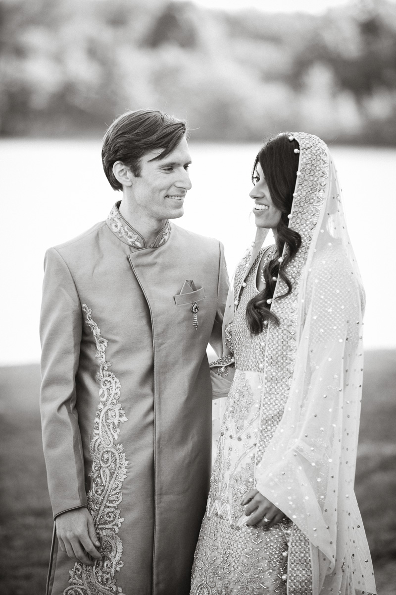 Black and white portrait of the bride after their outdoor Indian wedding ceremony.