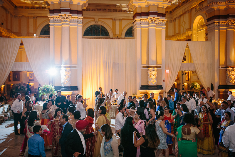 During this American-Indian wedding, many follow traditional, intricate ceremonies at the reception in Philadelphia.