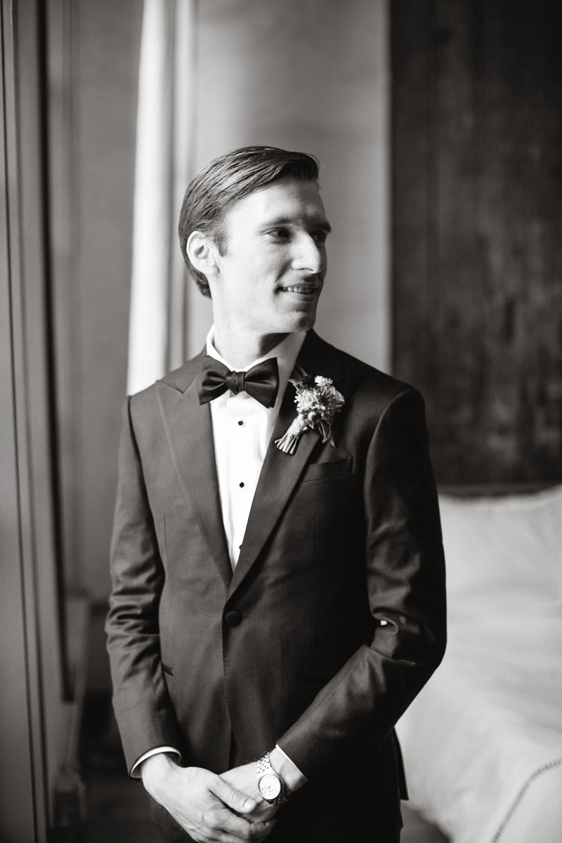 Black and white portrait of the groom in Lokal hotel in Philadelphia.