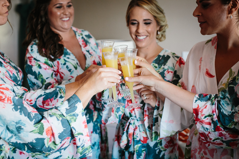 Bridesmaids celebrate the big day with mimosas before reception at the Reeds.